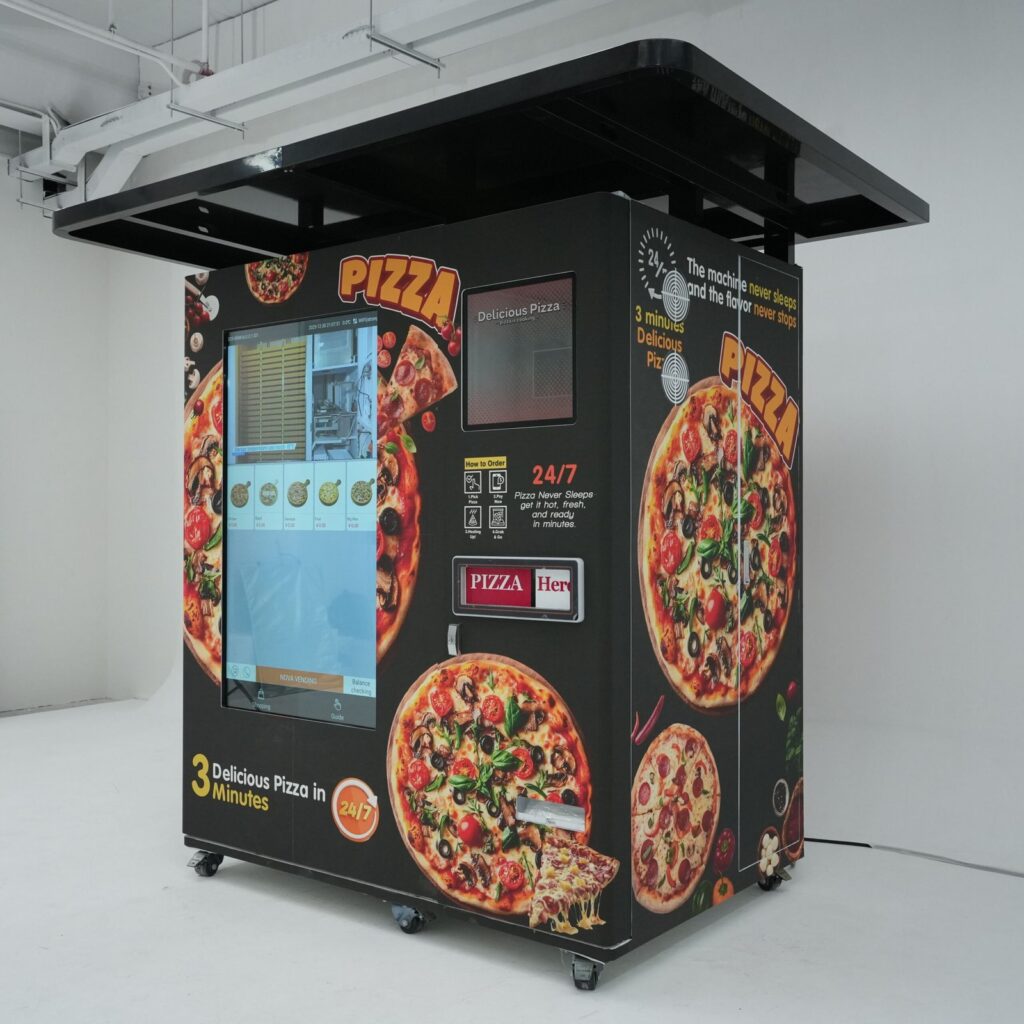 Nova Vending pizza vending machine studio product detail view with large touch screen, pizza-themed exterior, and pickup area